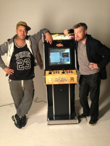 Jonathan and Charlie Brooker Using Arcade Machine